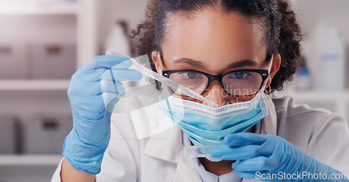 Image of Woman, scientist, petri dish and medical mask with focus on futuristic research and virus data. Science, African female person and young employee working in a laboratory with chemistry test analysis