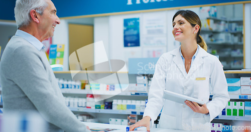 Image of Senior patient, tablet and happy woman, pharmacist or clerk helping clinic customer, healthcare client or person. Medicine shop, pharmacy advice and chemist search online database for store product