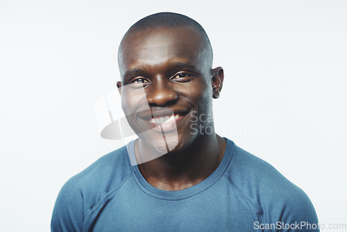 Image of Black man, smile and portrait with happiness and confidence in a studio from Jamaica. White background, African male person and happy model face with pride, style and casual fashion with skin glow