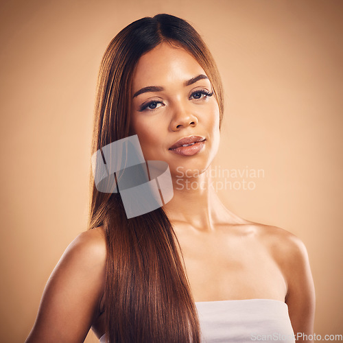 Image of Woman, hair style and beauty in studio portrait with cosmetic wellness, glow and shine by brown background. Girl, latino model and haircare with makeup, health and cosmetics with growth by backdrop