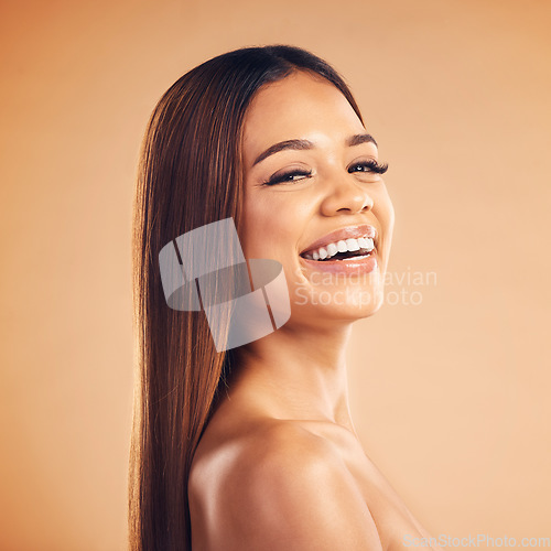 Image of Woman, hair style and health in studio portrait with cosmetic beauty, glow and shine by brown background. Girl, latino model and haircare with makeup, wellness and aesthetic with growth by backdrop