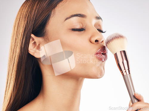 Image of Beauty, makeup brush and woman in a studio with a natural, cosmetic and luxury face routine. Glamour, cosmetology and female model with a cosmetics product for cheeks isolated by a white background.