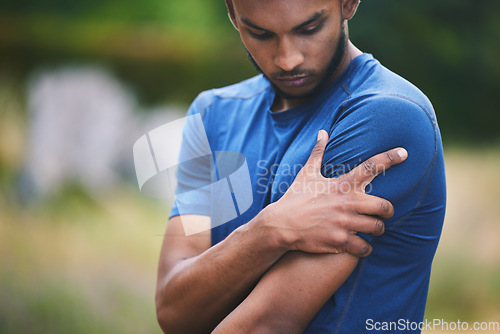 Image of Sports, fitness and man with pain in shoulder after workout, exercise and marathon training outdoors. Medical emergency, health and male person with muscle strain, arm injury and joint ache in park