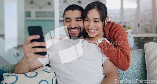 Image of Phone, happy and couple with smile on sofa for social media post, online website and internet. Communication, relationship and man and woman relax on smartphone for quality time, bonding and network