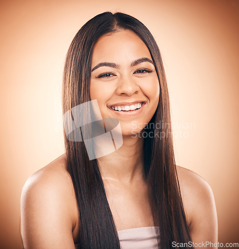 Image of Woman, hair style and cosmetics in studio portrait for beauty, healthy shine and smile by brown background. Girl, youth model and haircare with cosmetic, glow and self care for aesthetic by backdrop