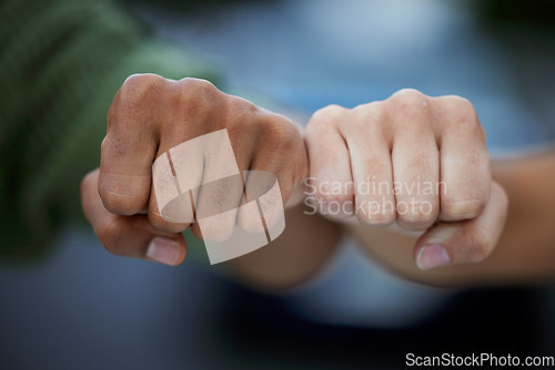 Image of Protest, fist and people in solidarity for justice, human rights and democracy on blurred background. Hands, diversity and men united for peace, change and power, transformation or community activism