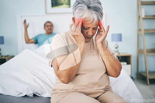Image of Senior couple, bed and conflict with a headache, fight and relationship issue with marriage, home and retirement. Partners, mature man and elderly woman with a migraine, bedroom and angry with stress