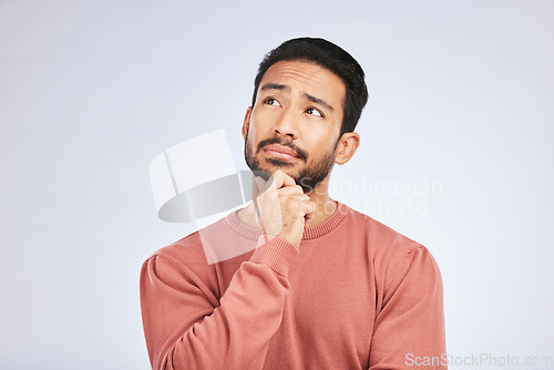 Image of Face, man and thinking of idea in studio or planning, decision and choice with white mockup background. Asian male, model and curious with doubt, questions or thoughtful guy, confused or remember