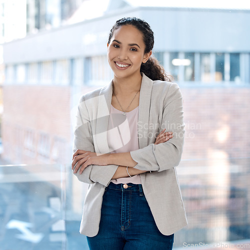 Image of Happy, arms crossed and portrait of business woman in office for professional, corporate and confident. Smile, happiness and pride with female employee at window for mission as expert or entrepreneur