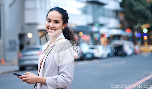 Image of Happy, portrait and a woman in the city with a phone for communication, social media and a chat. Smile, internet and a young employee with a mobile in the street for a a gps, notification and typing