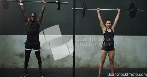 Image of Weight lifting, fitness and black man and woman with barbell in gym for training, exercise and workout. Strong, sport and female and male body builder lift weights for challenge, wellness or strength