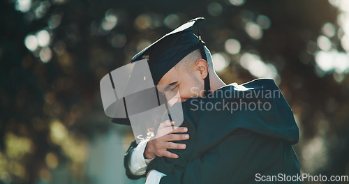 Image of Hug, graduation and education with friends in college for celebration, scholarship and congratulations. Study, university and success with students hugging on campus for achievement, school and event