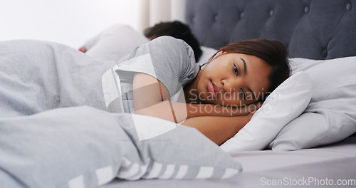 Image of Sad woman, bed and couple in a bedroom lying depressed after fight in the morning. Conflict, depression and fighting of a female person with partner together in a home thinking of divorce problem