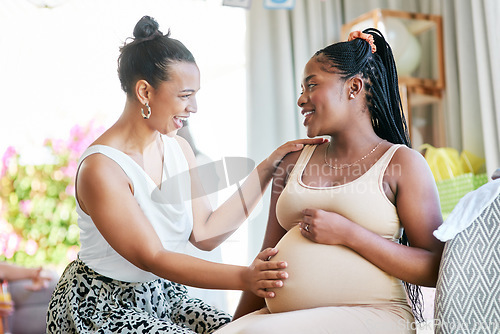 Image of Pregnant, friends and woman touching a stomach, baby shower and excited with happiness, home and support. Female people, girls and lady feeling belly, pregnancy and event with celebration and party