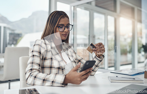 Image of Business, cellphone and woman with a credit card, online shopping and ecommerce in a modern office. Female person, employee and agent with payment, smartphone and internet connection for transaction