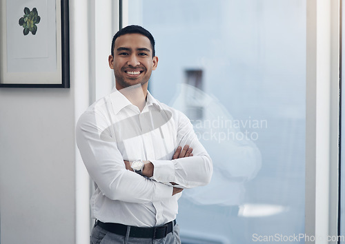 Image of Portrait, business and man with arms crossed, window and employee with confidence, startup success and career. Male person, happy agent or entrepreneur in a modern office, professional and happiness