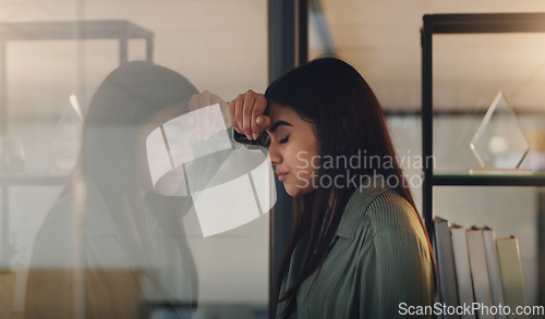 Image of Business, window and woman with stress, night and mental health issue with fatigue, schedule and anxiety. Female person, tired employee and agent with depression, evening and mistake with burnout