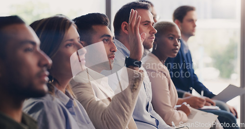 Image of Audience, conference and question of a business man with hand up at a seminar, workshop or training. Diversity men and women crowd at a presentation for learning, knowledge and faq discussion