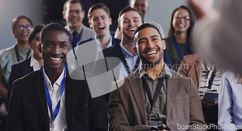 Image of Laughing, happy and business people or audience at conference, seminar or training workshop. Diversity men and women crowd at presentation or convention for corporate education, knowledge or talk