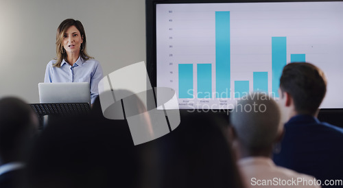 Image of Presentation, speaker or business woman and screen graphs, workshop or seminar training. Professional men, women or conference podium for digital learning, knowledge and discussion for sales growth