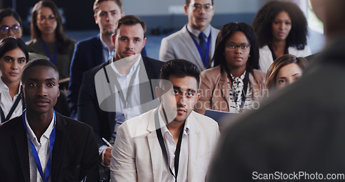 Image of Business people, conference and audience listening to speaker at a seminar, workshop or training. Diversity men and women crowd at a presentation for learning, knowledge and corporate discussion