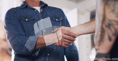 Image of Handshake, meeting and teamwork with men in a workshop together for a deal or agreement. Partnership, welcome and greeting with male industry people shaking hands in a factory to gesture thank you