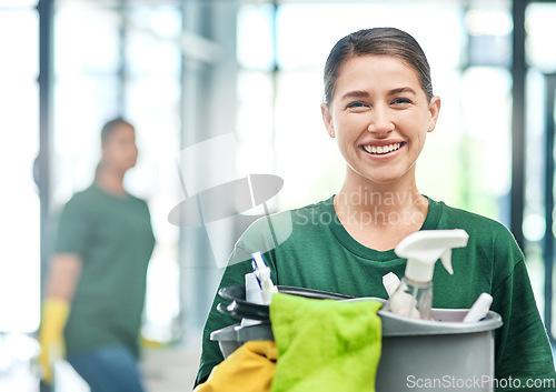 Image of Happy, product and portrait of a woman with a cleaning service, tools and bucket for work. Smile, office and a young female cleaner with products to clean a workplace, disinfection staff and job