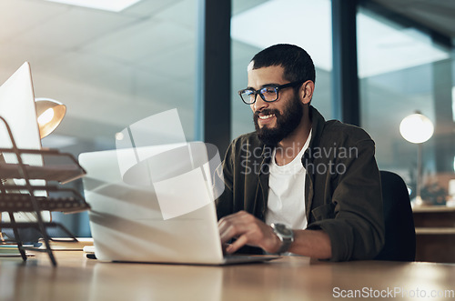 Image of Smile, work and a businessman with a laptop for an email, communication or online coding. Happy, programming and a male programmer typing on a computer for web or software development in an office