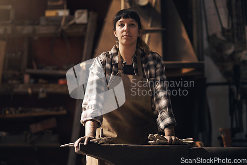 Image of Foundry, workshop and portrait of woman with tools for industry, manufacturing and manual labor. Industrial factory, welding and female person for steel, iron and metal production for craftsmanship