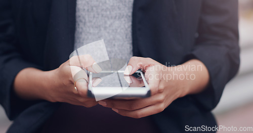 Image of Hands, phone and business woman in city for closeup texting, networking or email communication on web. Businesswoman, smartphone and typing in metro street with social media app, chat or contact