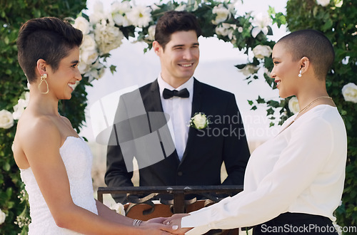 Image of Love, holding hands and lgbtq with lesbian couple at wedding for celebration, gay and pride. Smile, spring and happiness with women at marriage event for partner commitment, bride and freedom