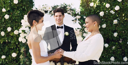 Image of Love, holding hands and happy with lesbian couple at wedding for celebration, gay and pride. Smile, spring and happiness with women at marriage event for partner commitment, sexuality and freedom