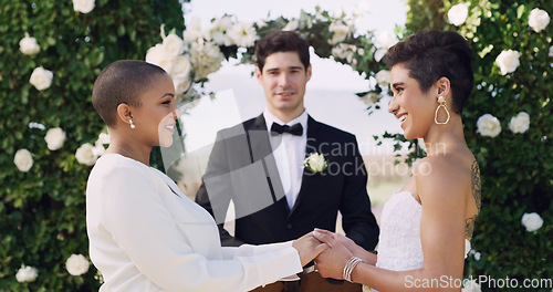 Image of Love, holding hands and smile with lesbian couple at wedding for celebration, gay and pride. Lgbtq, spring and happiness with women at marriage event for partner commitment, care and freedom