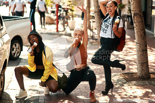 Image of Women friends, ice cream and street in city with edgy gen z fashion, comic pose or happiness on travel. Group, young woman and students with smile, gelato or dessert on summer vacation for crazy trip