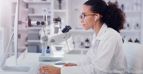 Image of Computer, music and science with woman in laboratory for research, pharmacy or medical. Healthcare, technology and study analysis with female scientist and focus for medicine, expert or online report