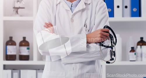 Image of Closeup, doctor and arms crossed with stethoscope in lab for healthcare, medical research and innovation. Laboratory worker, scientist and development in cardiology, pharmaceutical science and test