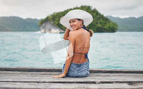 Image of Travel, island and portrait of woman by ocean for holiday, summer vacation and weekend getaway in Maldives. Happy, tropical beach and female person on boardwalk for tourism, luxury trip and adventure