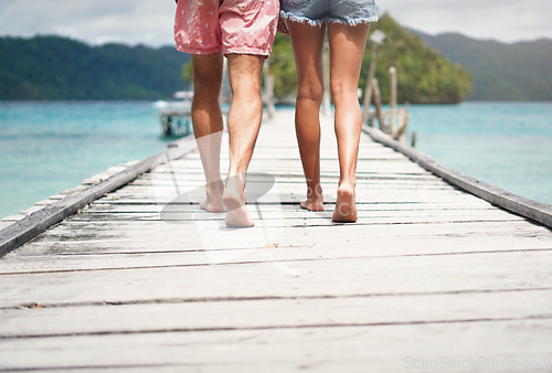 Image of Couple legs, walking and deck on a tropical island on vacation with freedom by sea. Ocean, beach and Thailand walk of a man back and woman together with love in summer on a holiday outdoor in sun