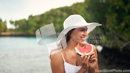 Image of Woman, watermelon and holiday outdoor with a smile by the sea on a summer vacation. Happiness, female person and relax with fruit and healthy food in nature by the ocean with freedom and travel