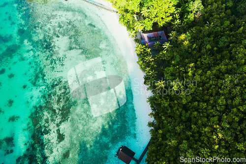 Image of Ocean, coastline and tropical island with clear water ariel angle view in nature on vacation for scenery. Sea, beach and summer paradise for a relaxing vacation with sunshine for traveling and peace.