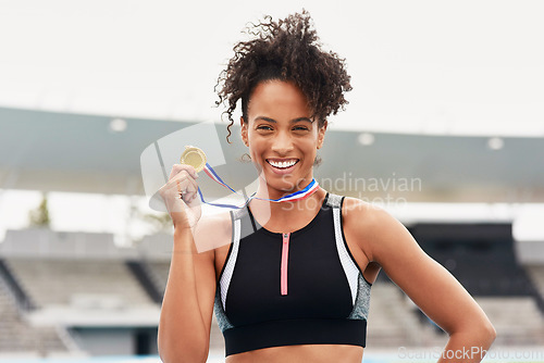 Image of Happy woman, fitness and portrait smile with gold medal for winning, athletics or running competition at stadium. Fit and active African female person, runner or winner smiling with award in victory