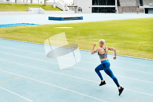 Image of Woman, race and athlete running track on stadium for exercise, cardio training or workout outdoors. Fit, active or sporty female person or runner in sports fitness, run or athletics for wellness