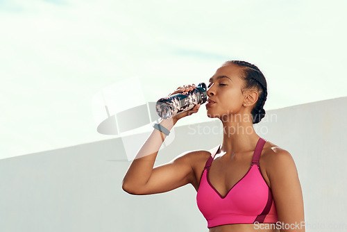 Image of Fitness, woman and drinking water for hydration from workout, exercise or training outdoors. Sports, nutrition or thirsty female person in rest with drink for natural sustainability on mockup space