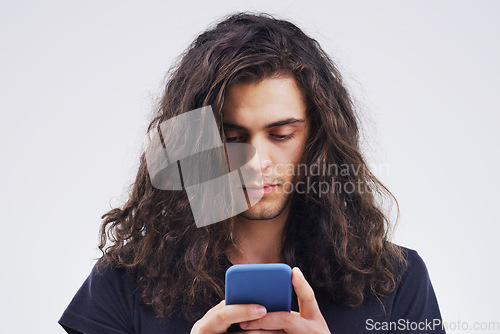 Image of Phone, communication and face of man in studio typing for social media post, internet and online chat. Mockup, white background and male person on smartphone for website, mobile app and networking