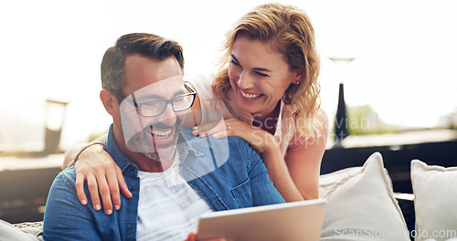 Image of Couple, happy and tablet for funny movie, streaming or laughing at meme or comedy on sofa. Woman, man and relax together on holiday with technology, watching tv show on stream service on mobile app