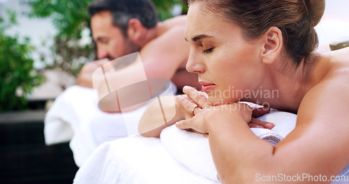 Image of Relax, spa and couple on a massage bed with peace, calm and luxury outdoor on a zen balcony. Love, romance and woman with man at a beauty salon or resort for vacation, holiday and relaxation in Bali