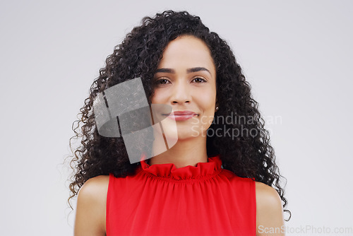 Image of Portrait, happy and curly with a woman in studio on a white background for beauty or fashion. Face, smile and natural style with an attractive young or real female person confident in trendy clothes