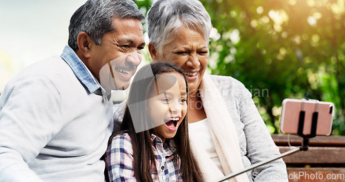 Image of Laugh, grandparents and young girl take selfie at the park or senior woman or man and excited for picture with kid. Family, child and happy for photo with elderly or spring and bench outside