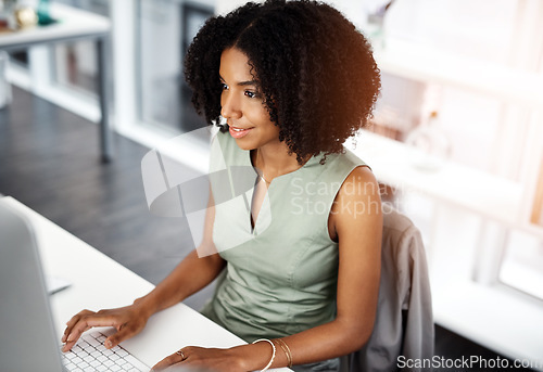 Image of Smile, research and business woman on a computer in office from above, happy and satisfied with web search. Online, review and African female person smile for report, proposal or creative inspiration