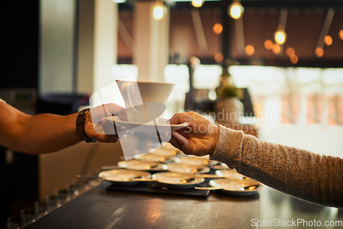 Image of Coffee shop customer, people and barista hands with tea cup, latte or matcha for client morning hydration. Restaurant store sale, cafe server and waiter giving woman drink, diner beverage or espresso